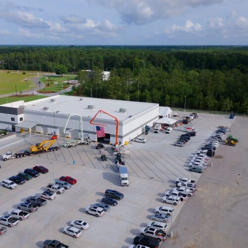 Aerial view of industrial building and parking lot