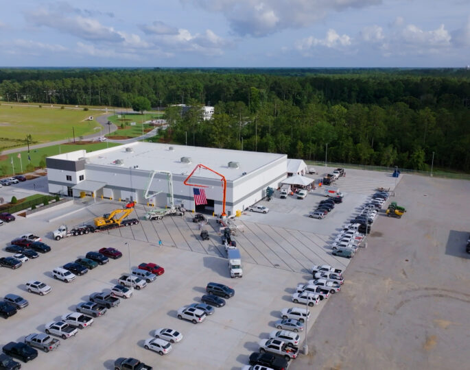 Aerial view of industrial building and parking lot