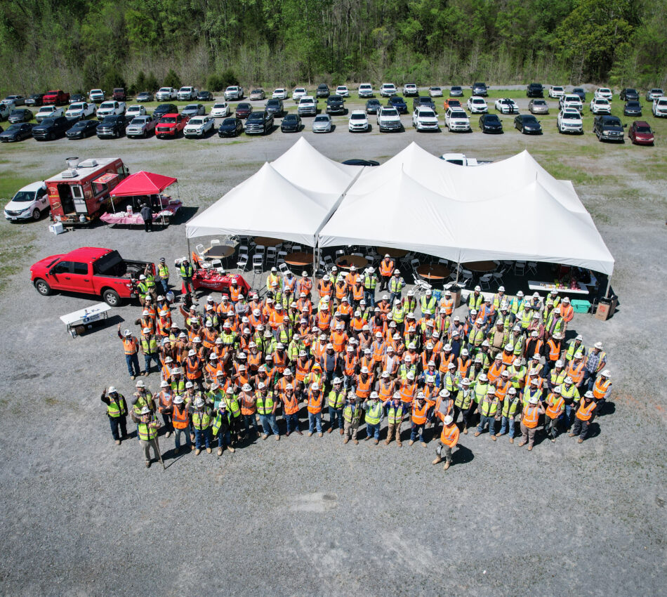 Aerial view of a large construction crew outdoors