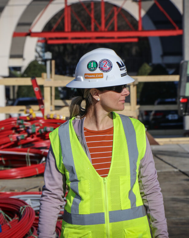 Female construction worker lookimg to the side
