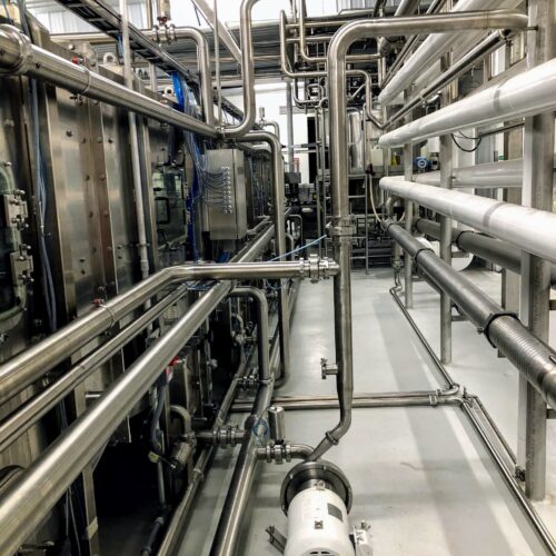 Stainless steel pipes and white motor, AFTER label bottom right.