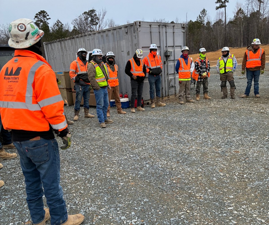 Wayne Brothers field team standing together on a jobsite